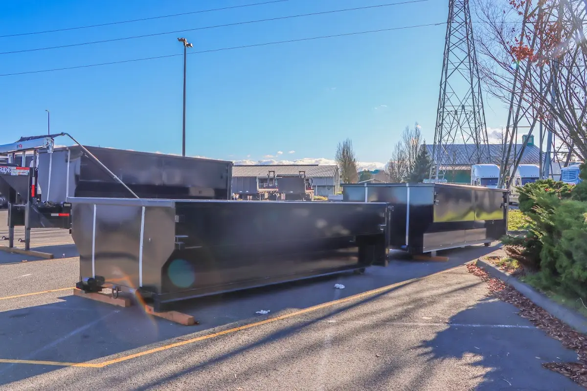 Roll-off dumpster ready for waste disposal at job site for Construction Dumpster Rental in Handy